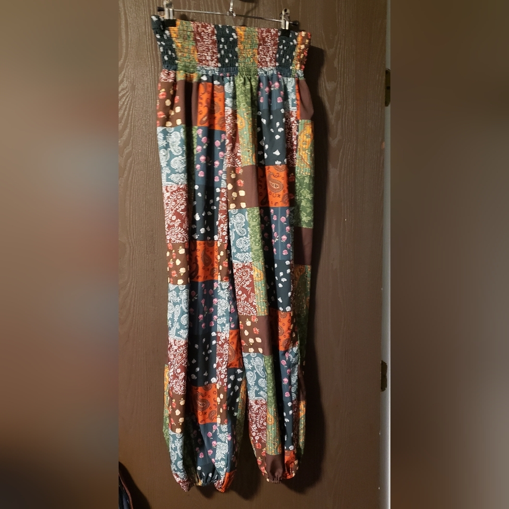 SHEIN pants with several 'patch Work' Designs. Size